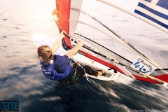 Girl competing in RS:X windsurfing class